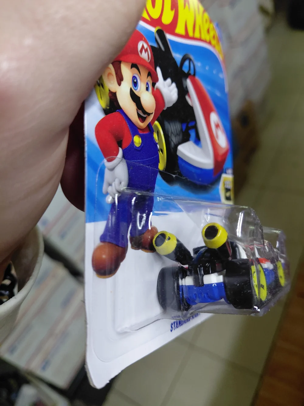 the Hot Wheels Mario Kart Standard Kart featuring Mario, part of the HW Screen T